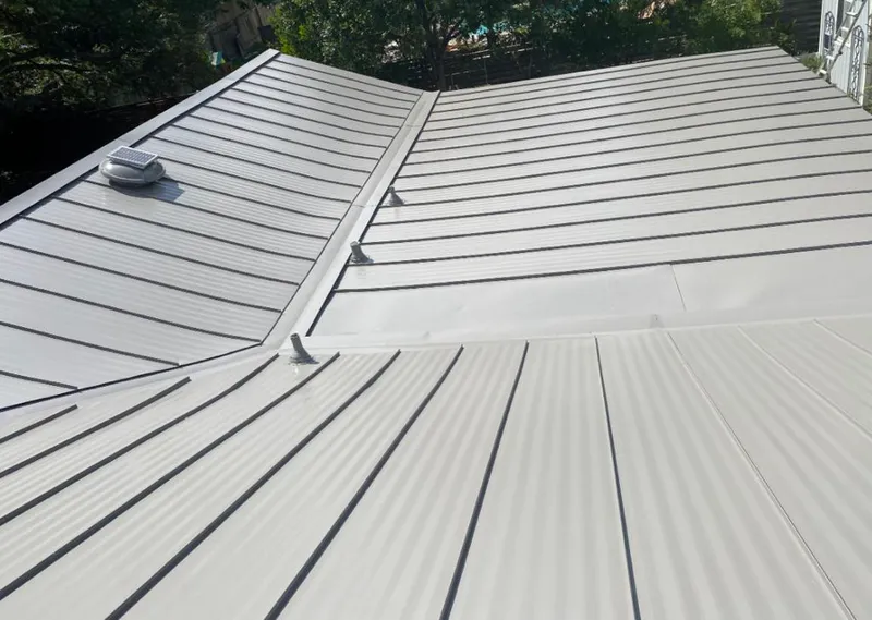 Solar attic fan installed on a metal roof for Roof Ventilation in Ellensburg